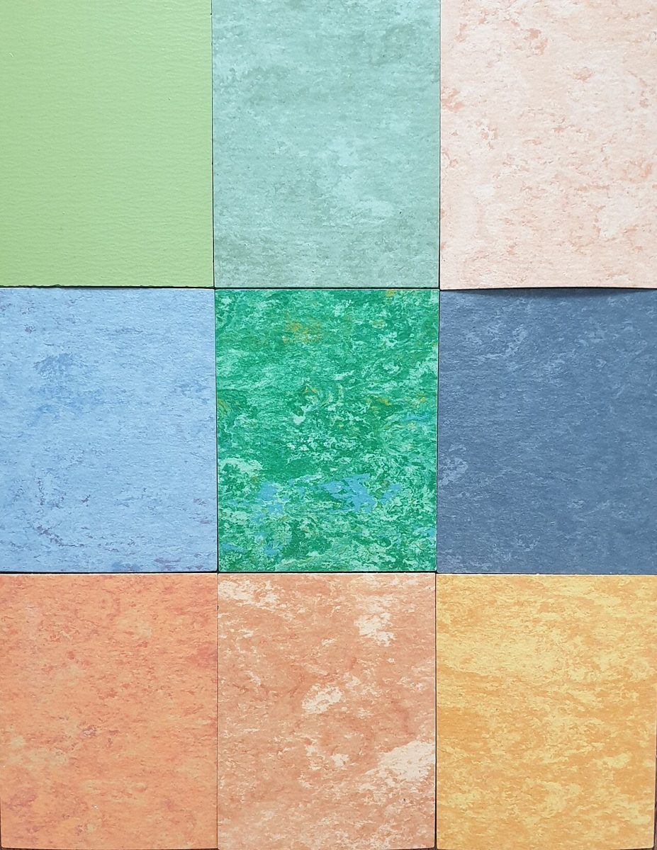 Nine square linoleum samples in marbled green, blue, orange, pink and yellow