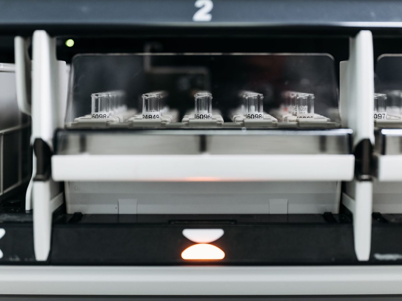 Close-up of laboratory equipment holding a rack of test tubes