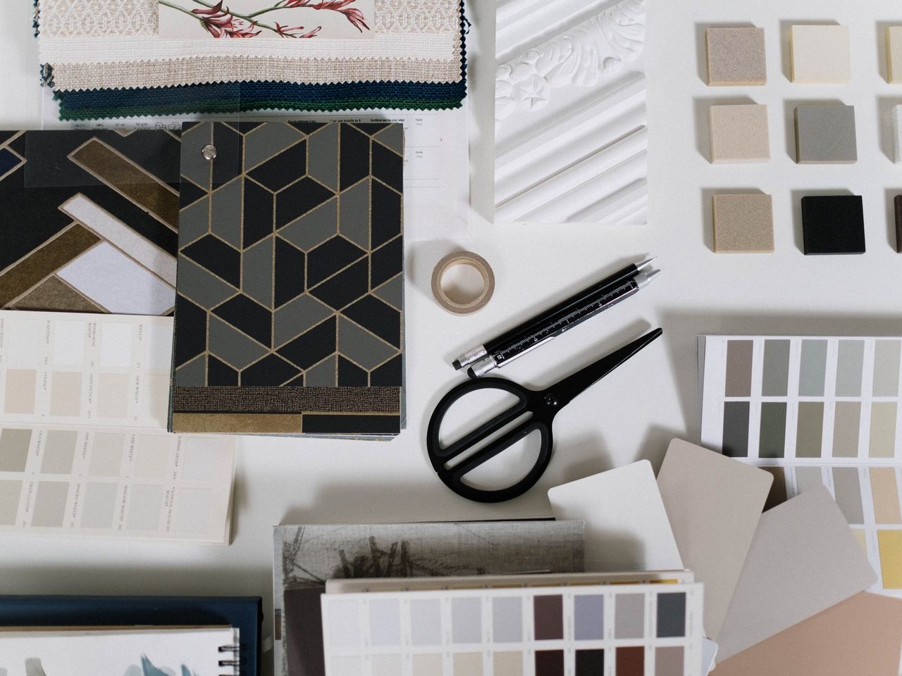 Flat lay of finish samples, tile swatches and scissors