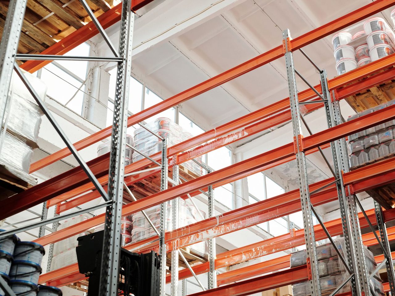 Orange and gray warehouse racking holding stored goods