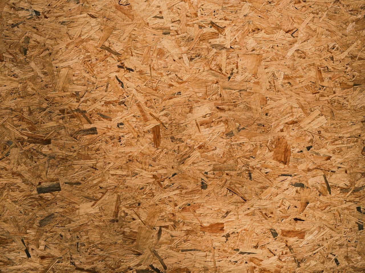 Close-up of oriented strand board with its pressed wood strands