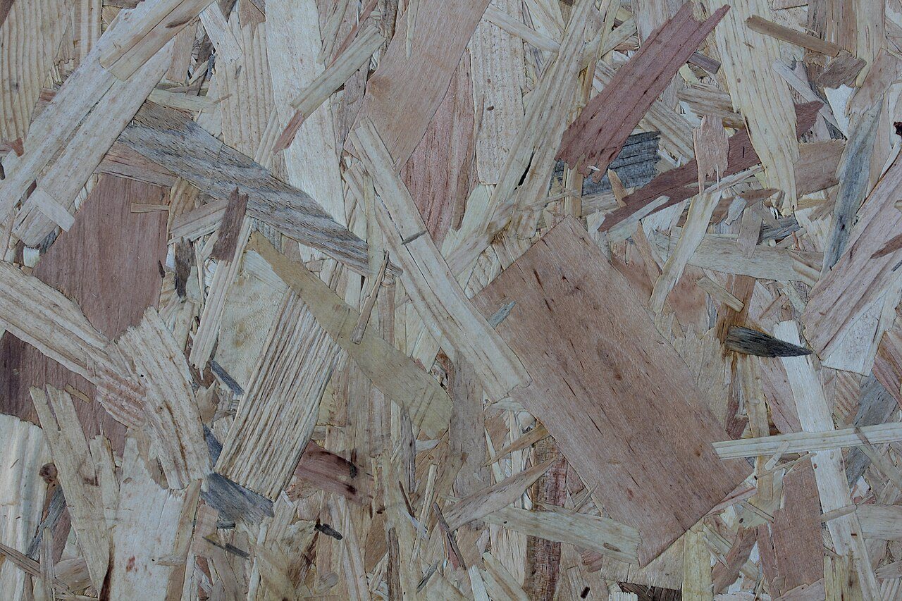 Close-up of oriented strand board showing large overlapping wood strands