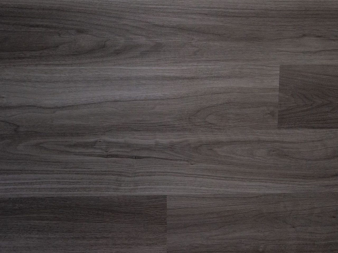 Dark gray wood-look plank floor with tight joints