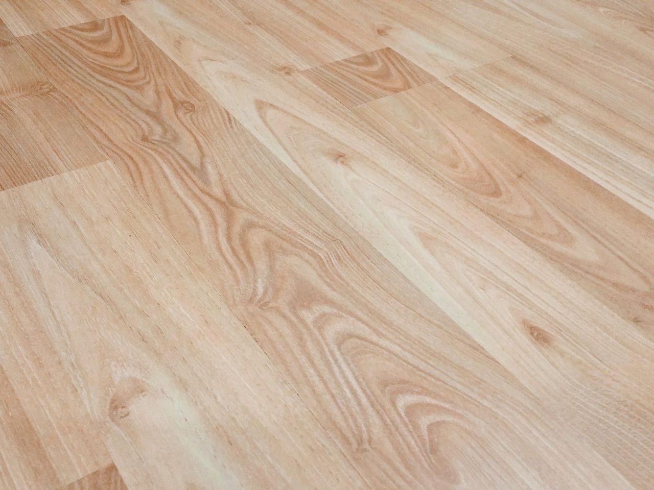 Light brown wood-look plank floor with natural grain pattern