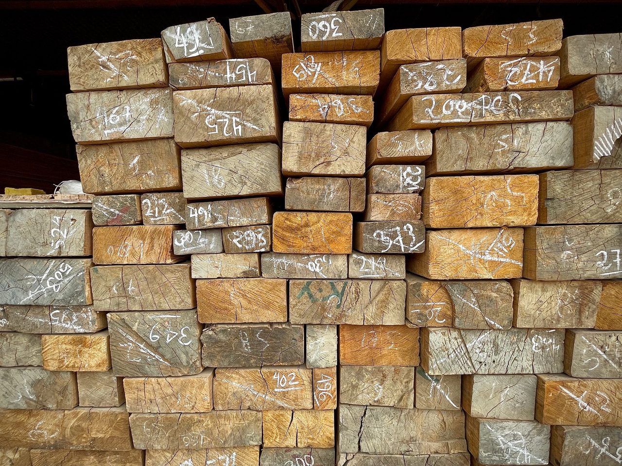 Stack of numbered timber ends in a warehouse