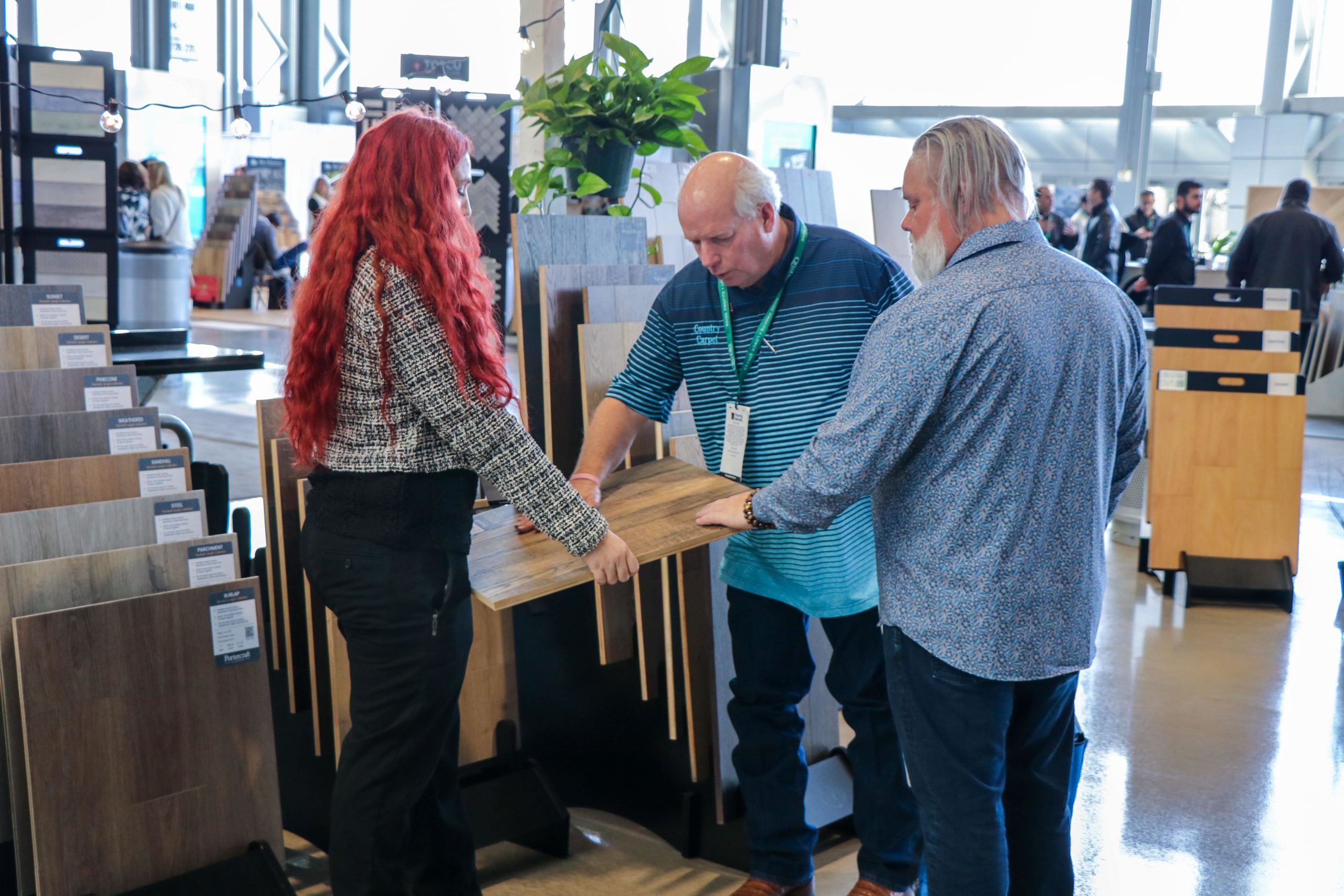 Trade show attendees discussing products and installation details