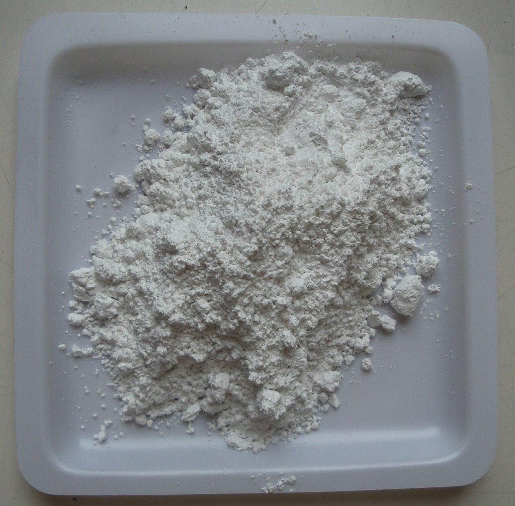 Pile of fine white chalk powder in a shallow plastic weighing tray