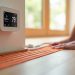 Radiant heat sensor placement under click-lock LVP flooring with temperature control panel