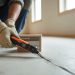 Testing subfloor moisture levels with a moisture meter before LVP flooring installation