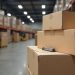 HDF core laminate flooring boxes stacked in a warehouse illustrating supply and lead time watch