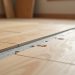 Click-lock LVP installation over plywood subfloor with fastener schedule and seam patching