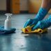 Removing scuff marks from rubber flooring safely using cleaning solution and cloth